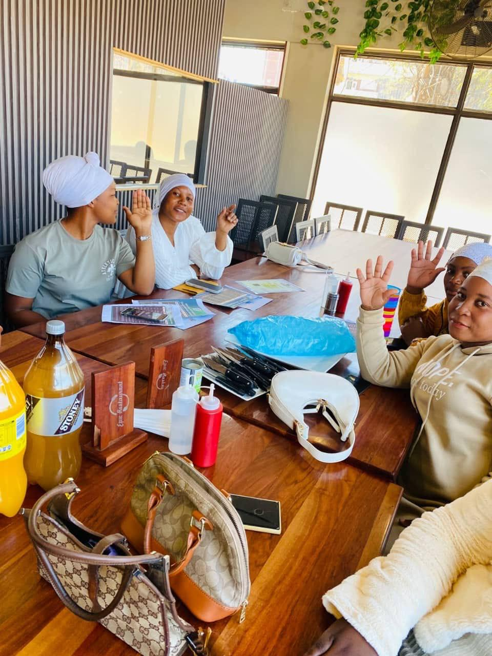 NEF members raising hands during a discussion