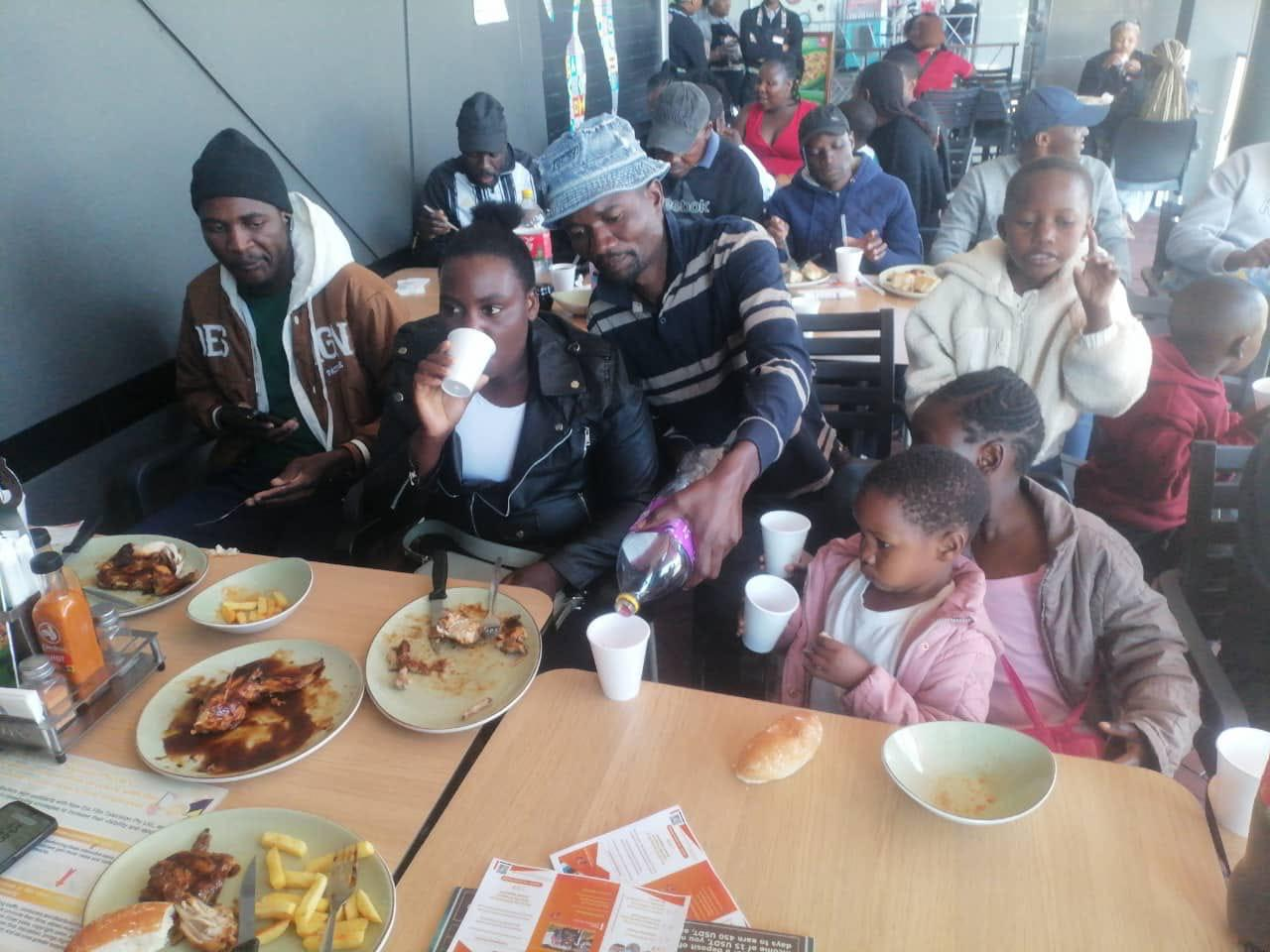 NEF families sharing a meal together