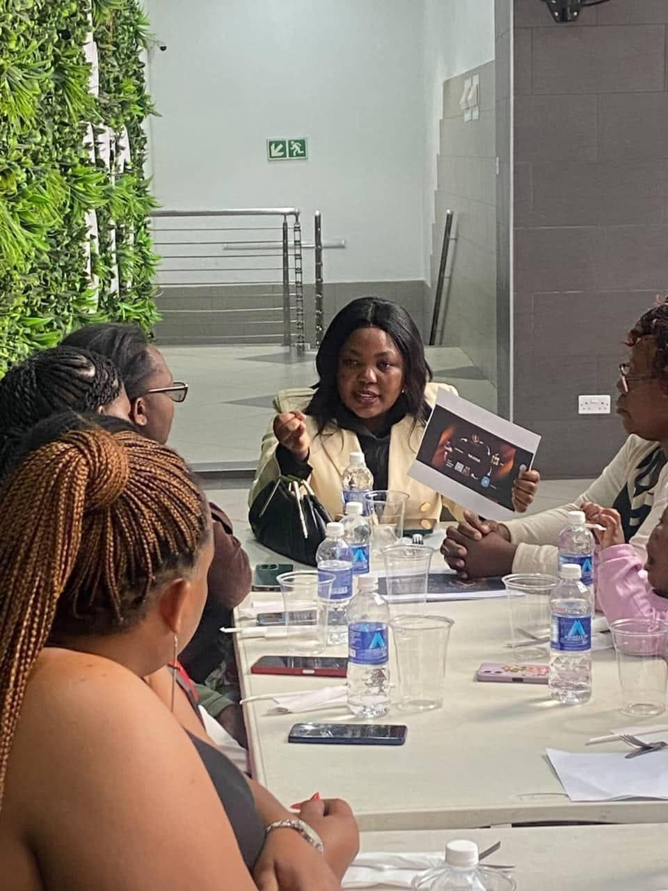NEF team leader presenting materials at a strategy meeting