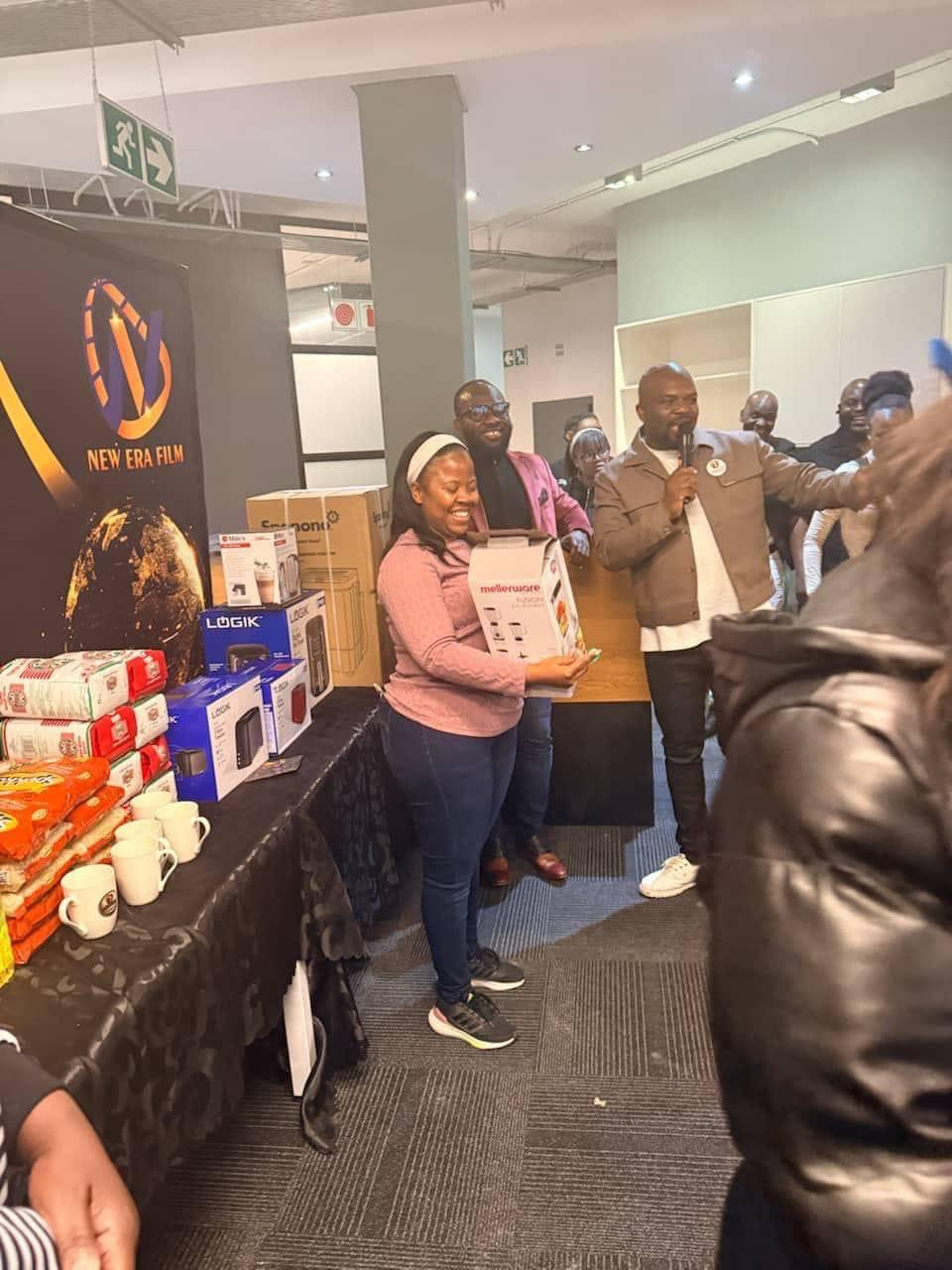 NEF member receiving an appliance reward at an event