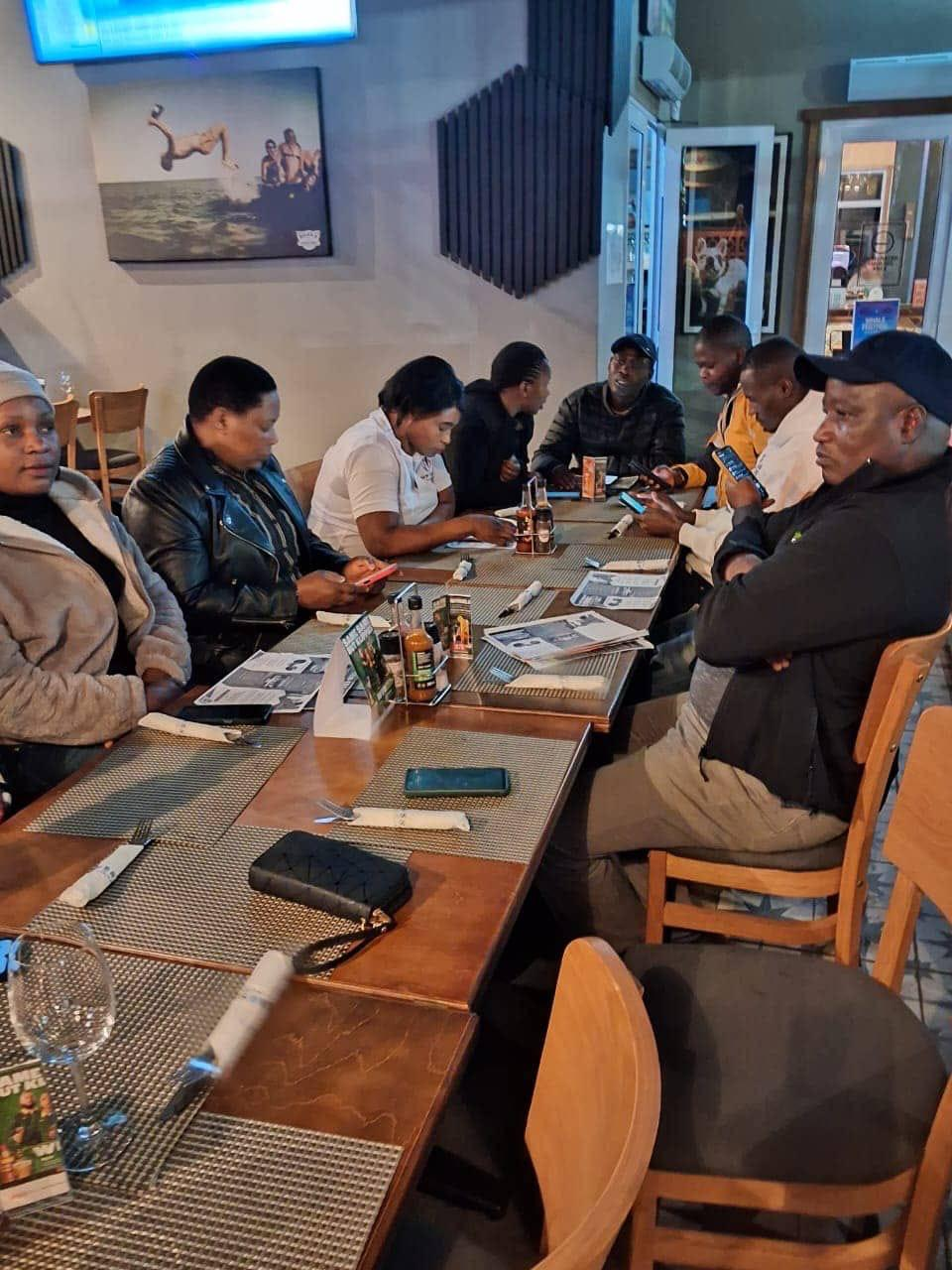 NEF team meeting around a table